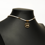 Aquarius Reef's 'Aquarius' choker - a white pearl and gold unisex beaded choker necklace from Aquarius Reef's Pearl collection, featuring a pendant with coordinates of the Great Barrier Reef.