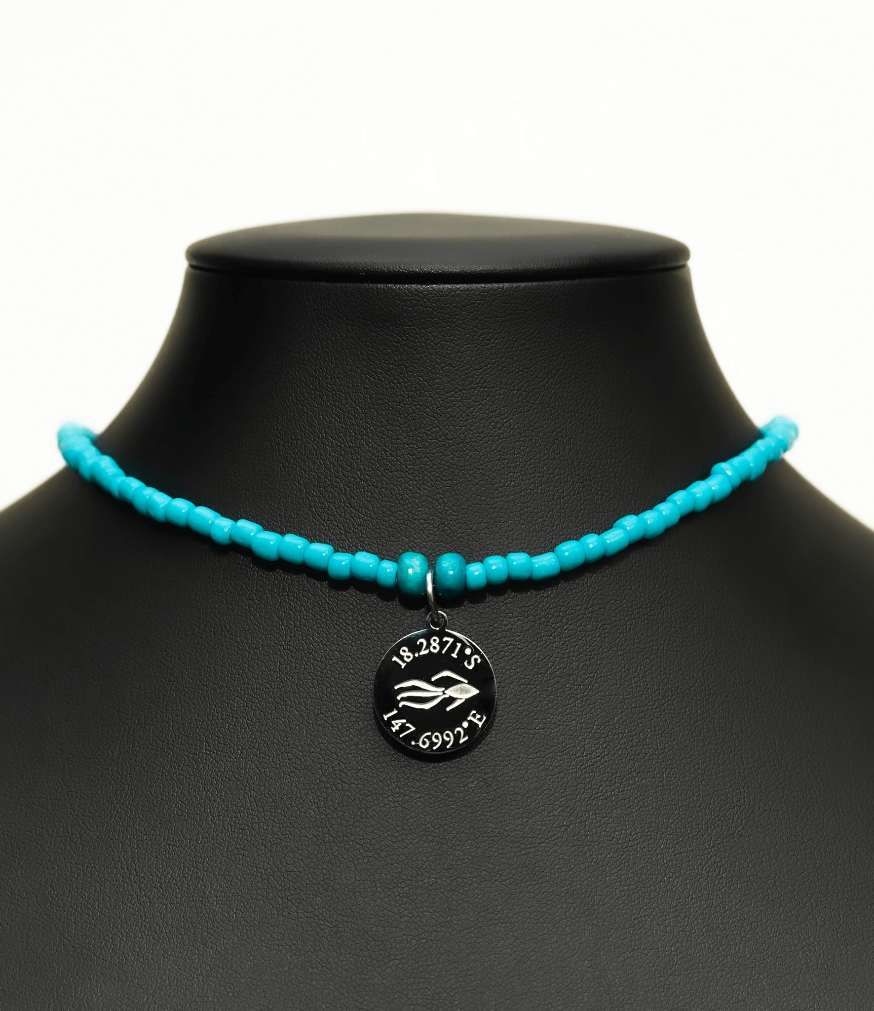 Aquarius Reef's silver 'Caribbean' choker - an all turquoise unisex seed beaded choker necklace in silver from Aquarius Reef's Edge collection, featuring a pendant with coordinates of the Great Barrier Reef.