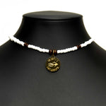 Aquarius Reef's gold 'Coconut' choker - a white and gold unisex beaded choker necklace from Aquarius Reef's Classic collection, featuring a pendant with coordinates of the Great Barrier Reef.