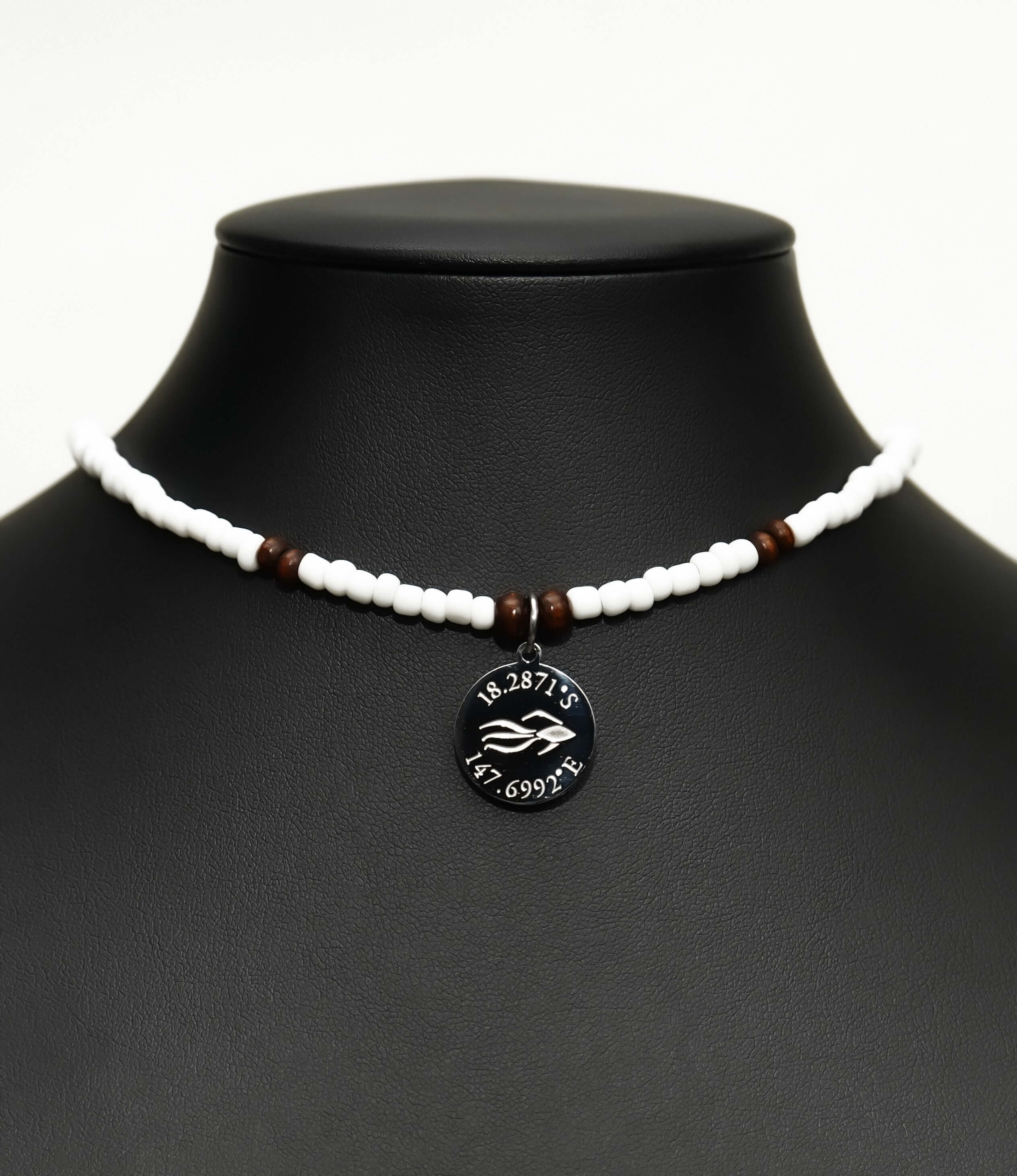 Aquarius Reef's silver 'Coconut' choker - a white and silver unisex beaded choker necklace from Aquarius Reef's Classic collection, featuring a pendant with coordinates of the Great Barrier Reef.
