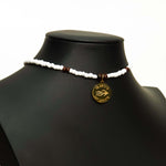 Aquarius Reef's gold 'Coconut' choker - a white and gold unisex beaded choker necklace from Aquarius Reef's Classic collection, featuring a pendant with coordinates of the Great Barrier Reef.