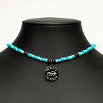 Aquarius Reef's 'Pacific' choker - a blue multicolor unisex seed beaded choker necklace in silver from Aquarius Reef's Edge collection, featuring a pendant with coordinates of the Great Barrier Reef.