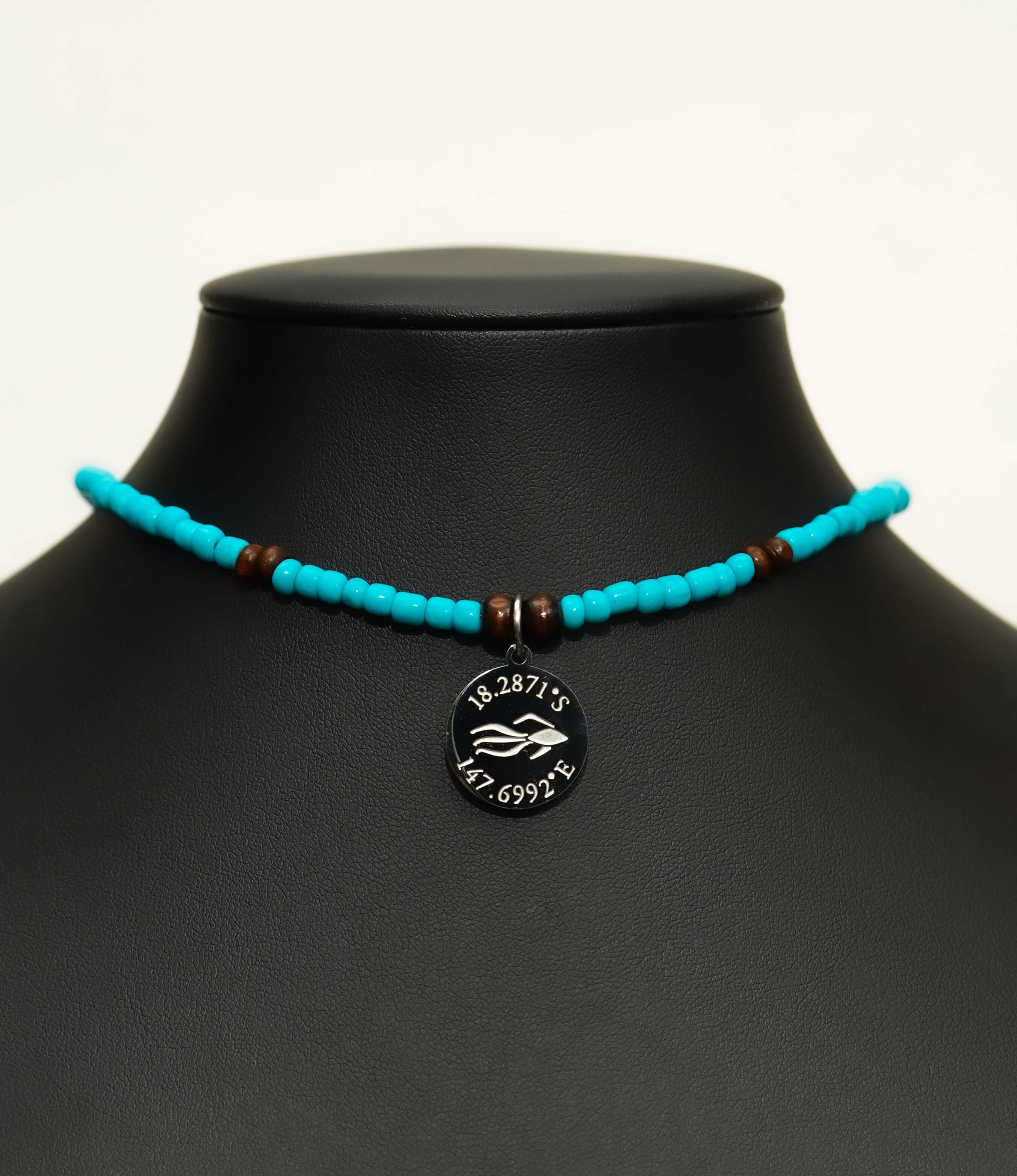 Aquarius Reef's silver 'Reef' choker - a turquoise and silver unisex beaded choker necklace from Aquarius Reef's Classic collection, featuring a pendant with coordinates of the Great Barrier Reef.