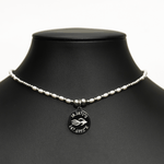 Aquarius Reef's white pearl 'Scales' choker - a white pearl and silver unisex beaded choker necklace from Aquarius Reef's Pearl collection, featuring a pendant with coordinates of the Great Barrier Reef.