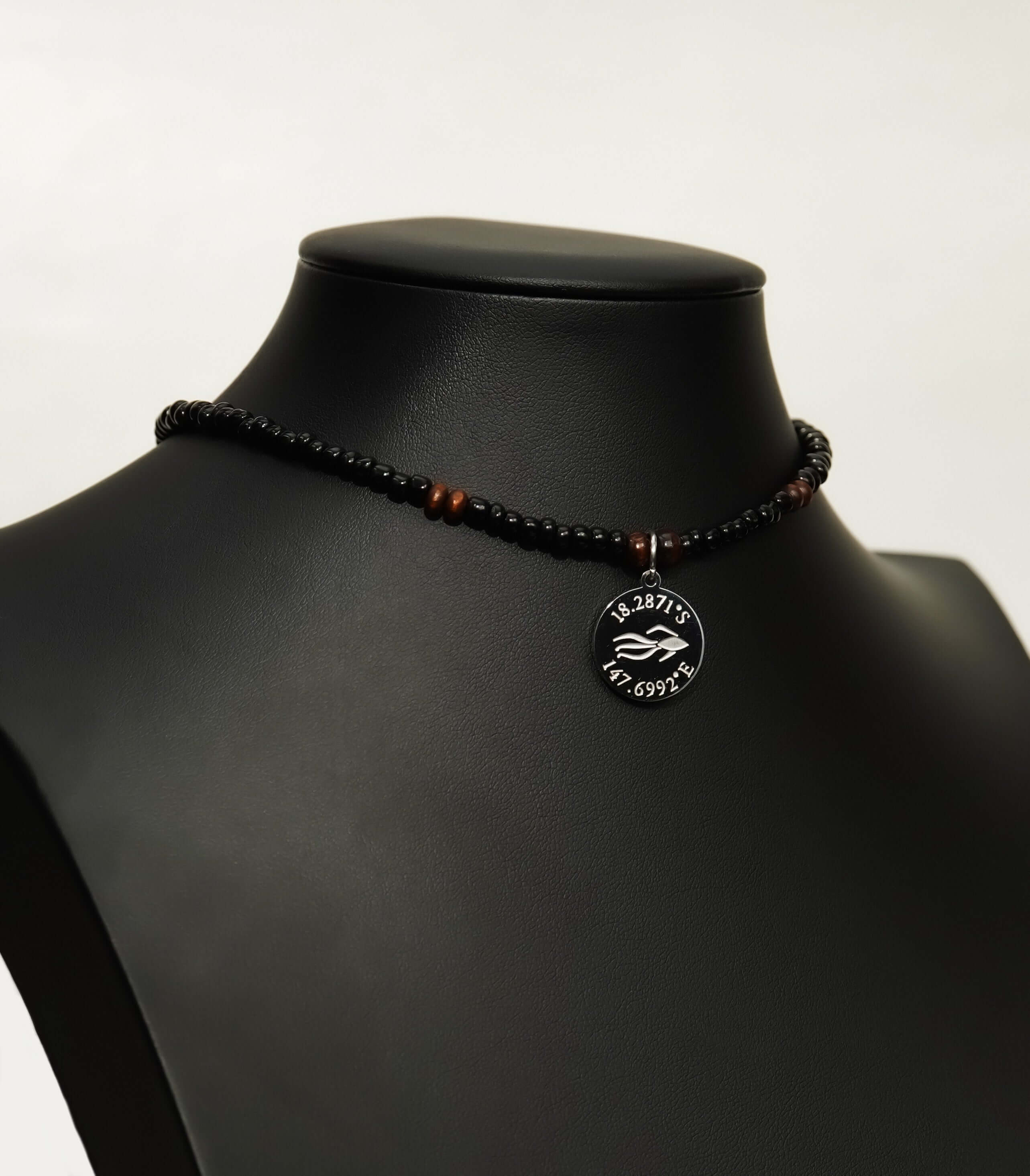 Aquarius Reef's silver 'Dare' choker - a black and silver unisex beaded choker necklace from Aquarius Reef's Classic collection, featuring a pendant with coordinates of the Great Barrier Reef.