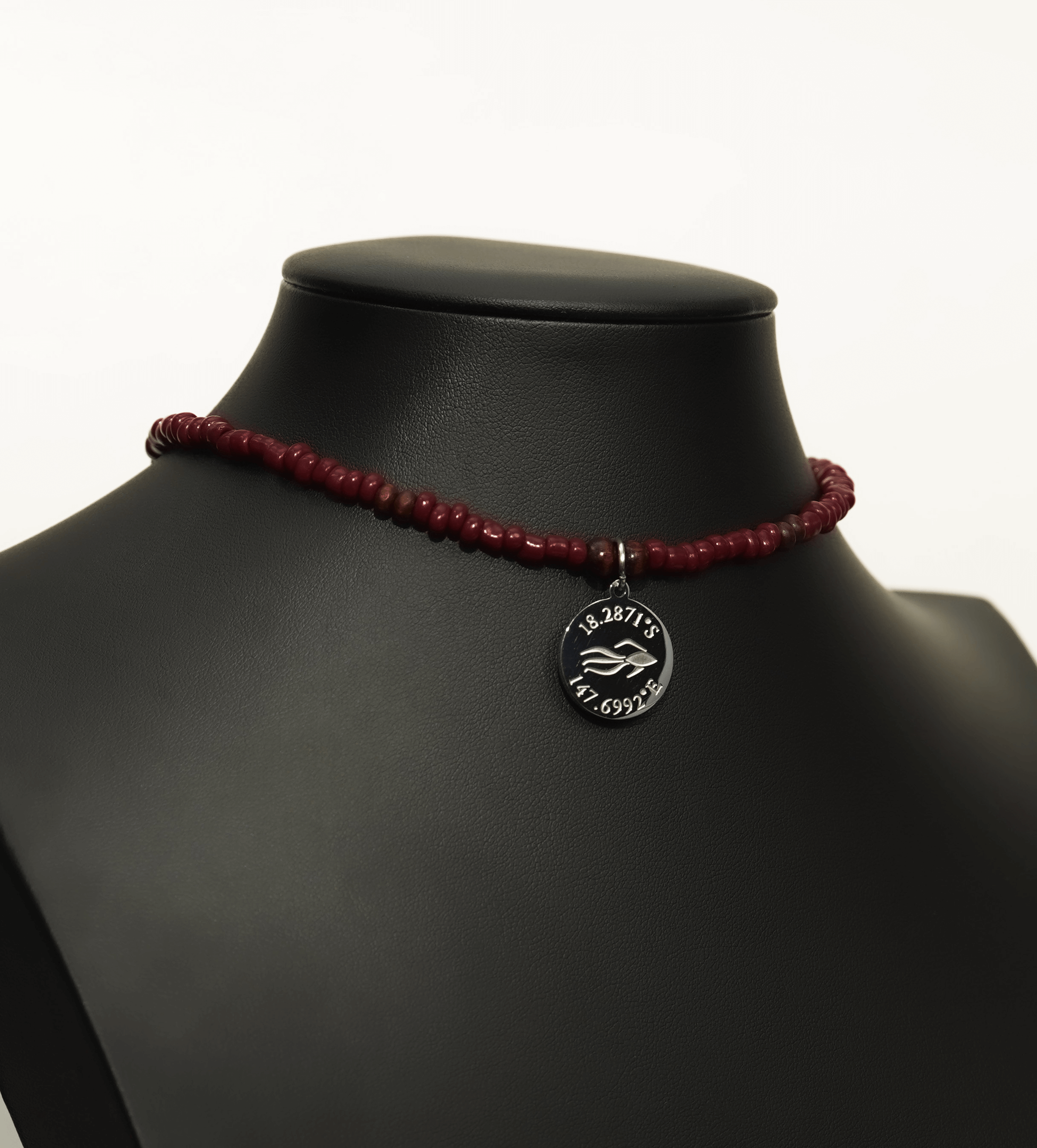 Aquarius Reef's 'Pulse' choker - a dark red unisex beaded choker necklace in silver from Aquarius Reef's Classic collection, featuring a pendant with coordinates of the Great Barrier Reef.