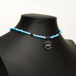 Aquarius Reef's 'West Coast' choker - a powder blue unisex beaded choker necklace in silver from Aquarius Reef's Classic collection, featuring a pendant with coordinates of the Great Barrier Reef.