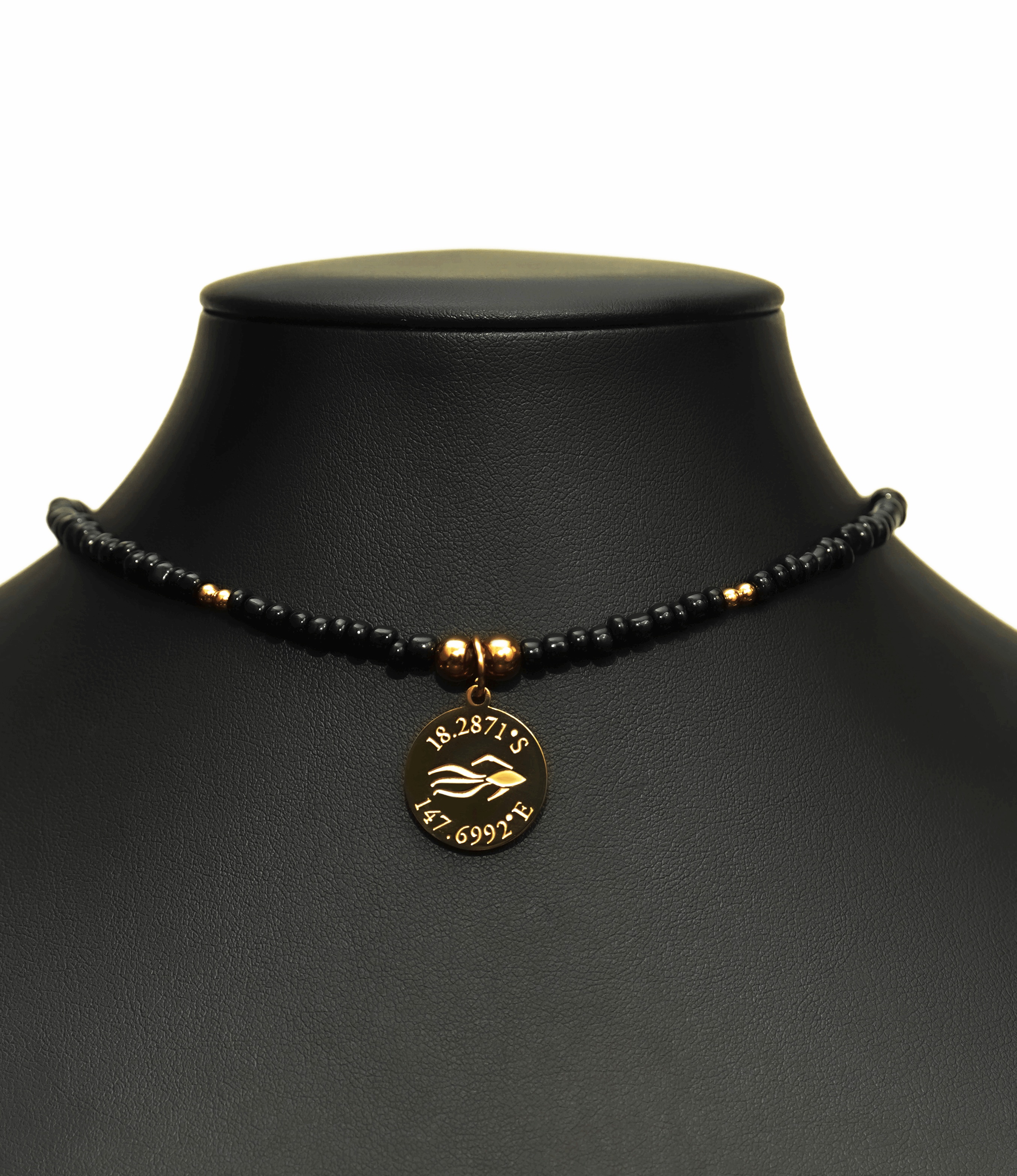 Aquarius Reef's gold 'Villain' choker - a black and gold unisex seed beaded choker necklace from Aquarius Reef's Edge collection, featuring a pendant with coordinates of the Great Barrier Reef.